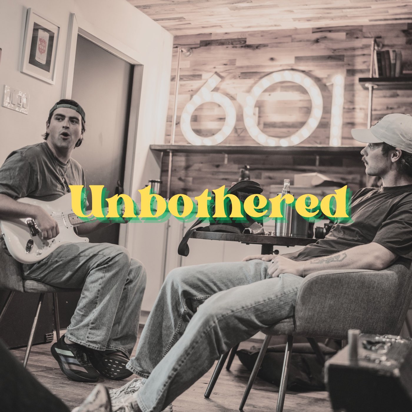 A candid picture of two people sitting in chairs.